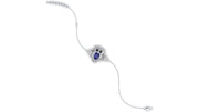 A delicate white gold bracelet featuring a central owl motif with a deep blue sapphire oval gemstone and small clear accent stones, shown on a plain white background.