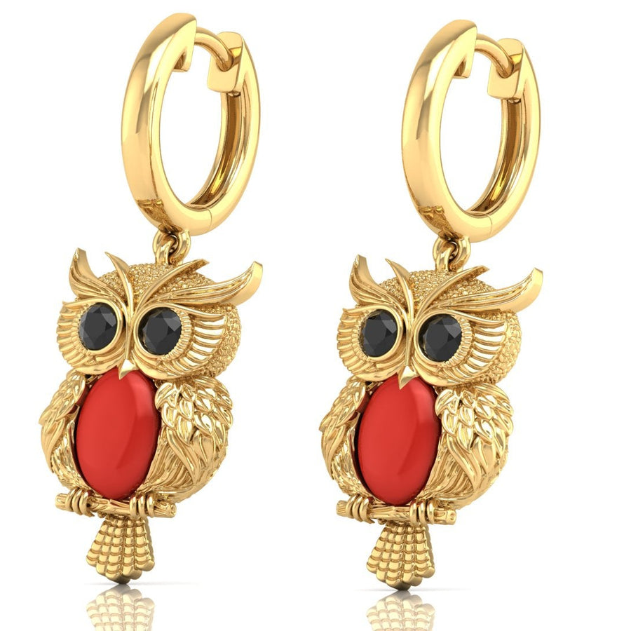 Gold owl-shaped earrings with red coral gemstones on a white background