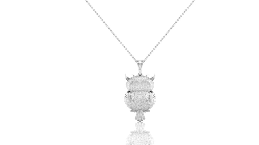 A white gold pendant necklace featuring a detailed owl design set with clear stones, suspended from a delicate silver chain against a solid white background.