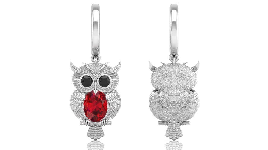 White Gold owl-shaped earrings with ruby gemstone on a white background