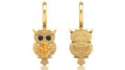 Gold owl-shaped earrings with yellow sapphire gemstones on a white background