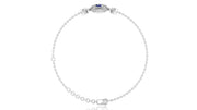 A delicate white gold chain bracelet with a small oval Blue sapphire gemstone centerpiece and clear stones, displayed on a clean white background.