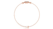 A delicate rose gold chain bracelet with a small oval charm and a matching adjustable lobster clasp, displayed on a clean white background.