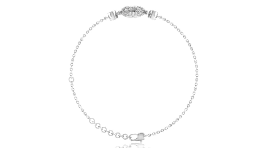 A delicate silver-toned chain bracelet with a small oval diamond centerpiece and clear stones, displayed on a clean white background.