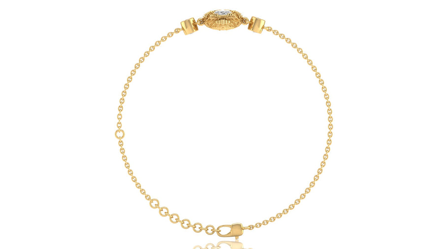 A delicate yellow gold chain bracelet with a decorative oval clasp featuring a diamond gemstone, displayed on a clean white background.
