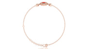 A delicate rose gold chain bracelet with a small oval red coral gemstone accent and a matching rose gold clasp, displayed on a clean white background.