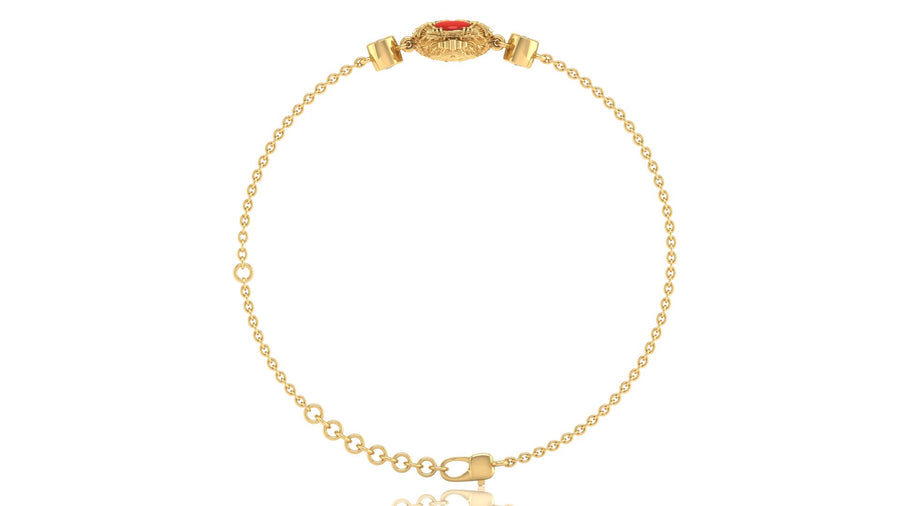 A delicate yellow gold chain bracelet with a decorative oval clasp featuring a red coral gemstone, displayed on a clean white background.