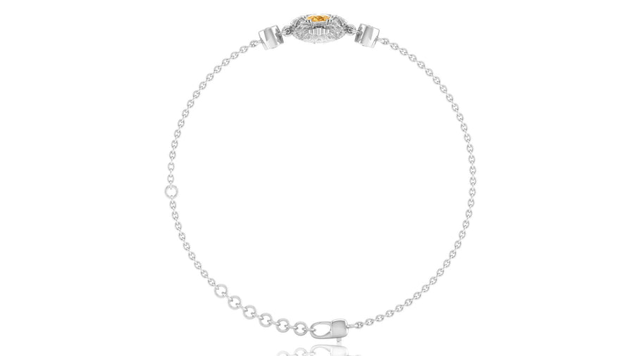 A delicate white gold chain bracelet with a small oval Yellow sapphire gemstone centerpiece and clear stones, displayed on a clean white background.