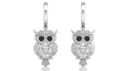 White Gold owl earrings with diamond gemstones on a white background