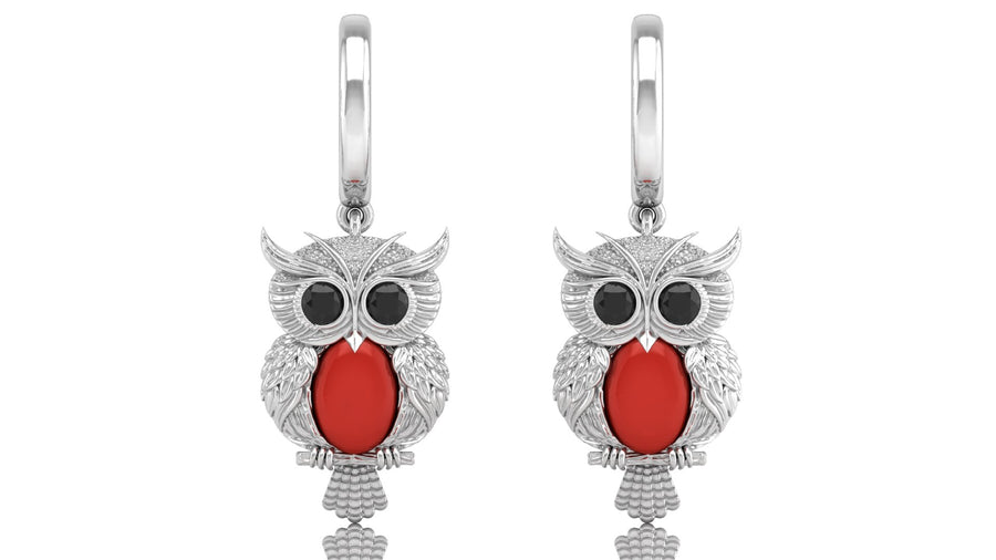 White Gold owl earrings with red coral gemstones on a white background