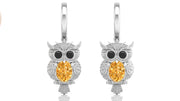 White Gold owl earrings with yellow sapphire gemstones on a white background