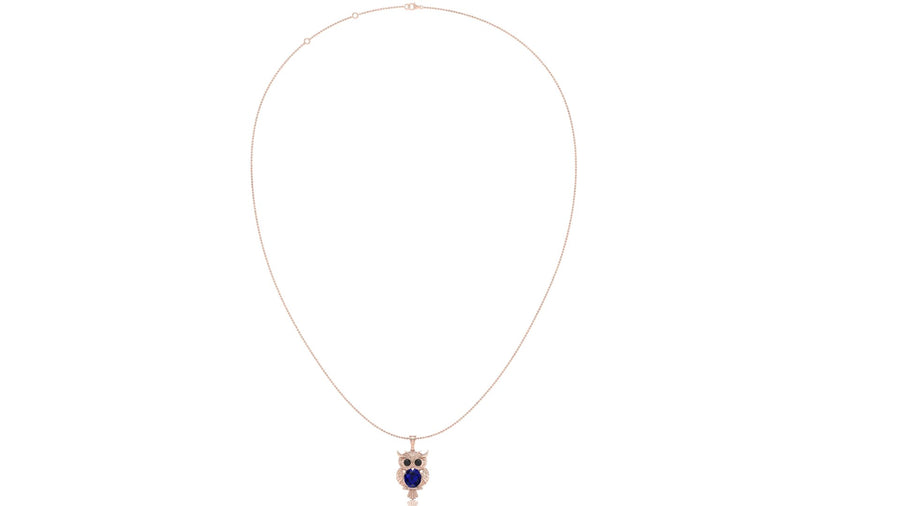 A delicate rose gold necklace featuring an owl pendant with a deep blue sapphire central stone and small pink gemstone accents, displayed on a clean white background.