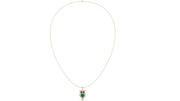 A delicate rose gold chain necklace featuring an owl pendant with a green emerald center and black eyes, displayed against a solid white background.
