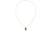 A delicate gold chain necklace featuring an owl pendant with emerald gemstone and gold details, displayed against a solid white background.