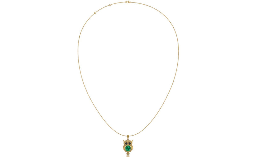 A delicate gold chain necklace featuring an owl pendant with emerald gemstone and gold details, displayed against a solid white background.