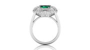 White Gold ring with a green gemstone on a white background