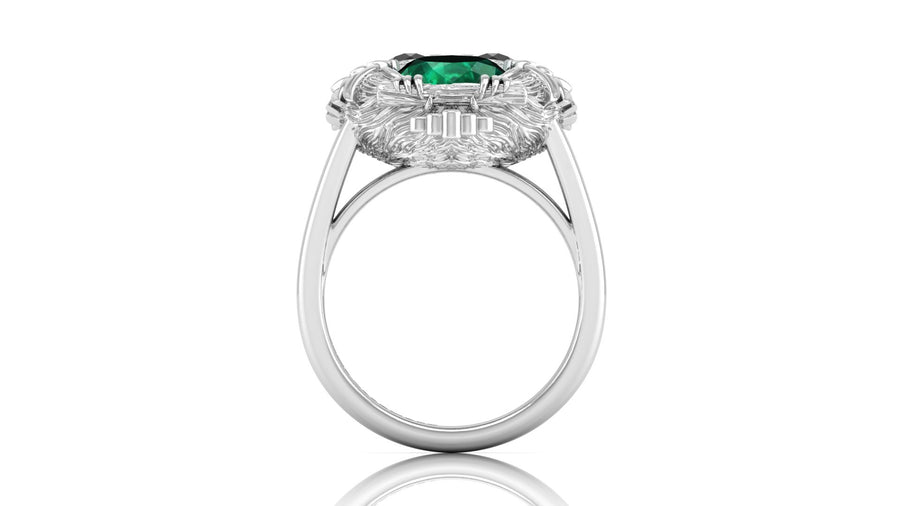 White Gold ring with a green gemstone on a white background