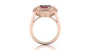Rose gold ring with a ruby gemstone on a white background