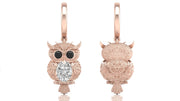 Rose gold owl-shaped earrings with diamond gemstones on a white background