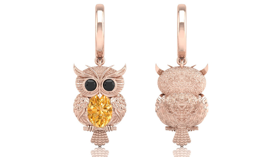 Rose gold owl-shaped earrings with yellow sapphire gemstones on a white background