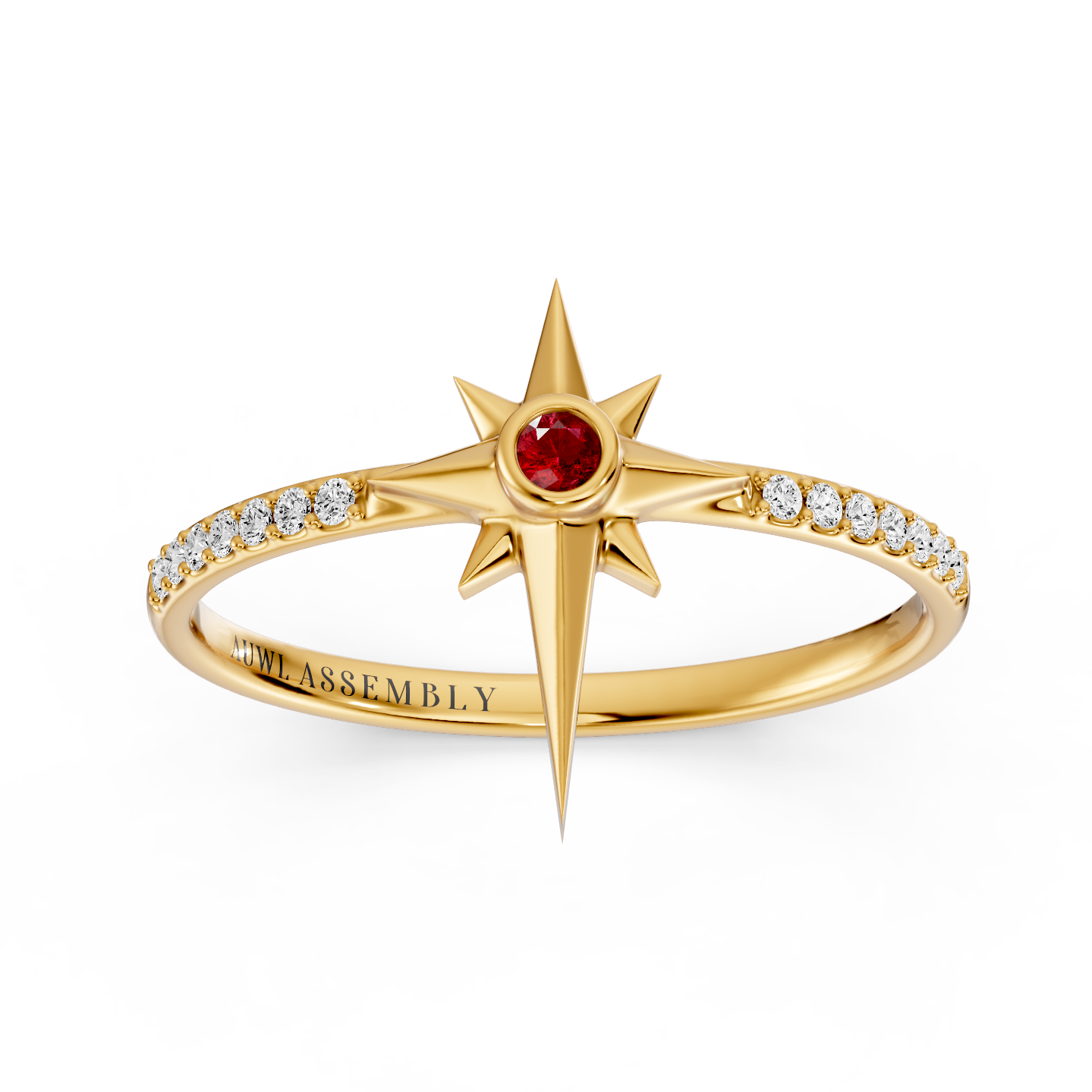 A Yellow gold starburst ring with a central red ruby gemstone and a band paved with small clear stones, shown on a plain white background. The inside of the band is engraved with 'AUWL ASSEMBLY'