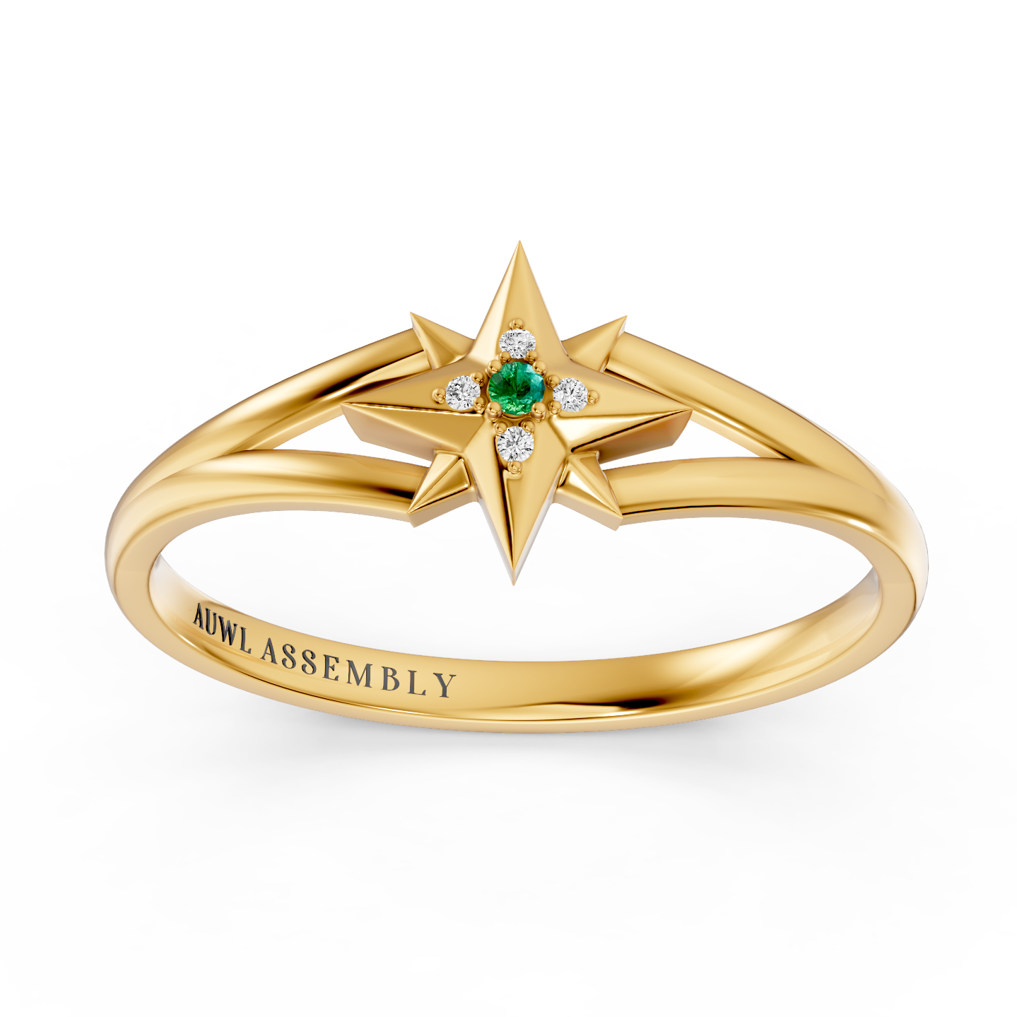 A yellow gold starburst ring with a central green emerald and small clear accent stones, shown on a clean white background. The inside of the band is engraved with the brand name 'AUWL ASSEMBLY'.