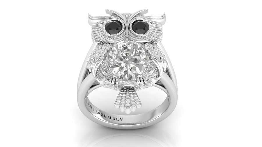 White Gold owl ring with a diamond gemstone on a white background