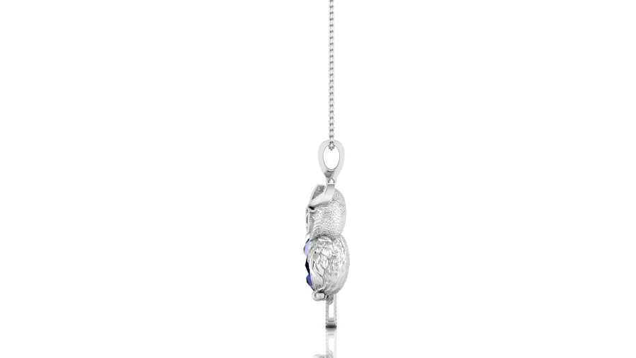 white gold pendant with a clear blue sapphire gemstone in the centre, on a white background