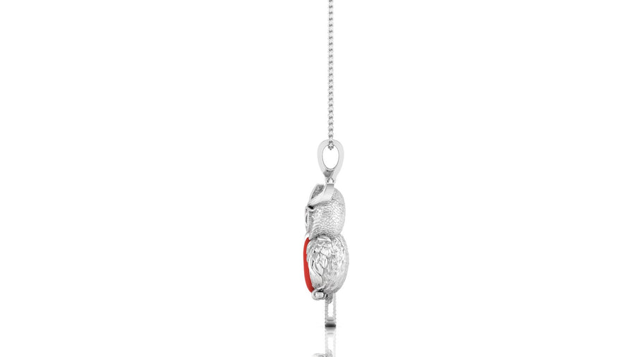 A white gold pendant necklace featuring a stylized, textured owl with a small red coral accent, suspended from a delicate silver chain against a white background.