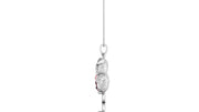 A white gold pendant necklace featuring a detailed bird charm with a red ruby gemstone centre, suspended from a delicate silver chain against a plain white background.