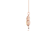 A rose gold pendant shaped like a sleeping squirrel, featuring a textured finish and a small yellow sapphire gemstone accent, hanging from a delicate rose gold chain against a solid white background.