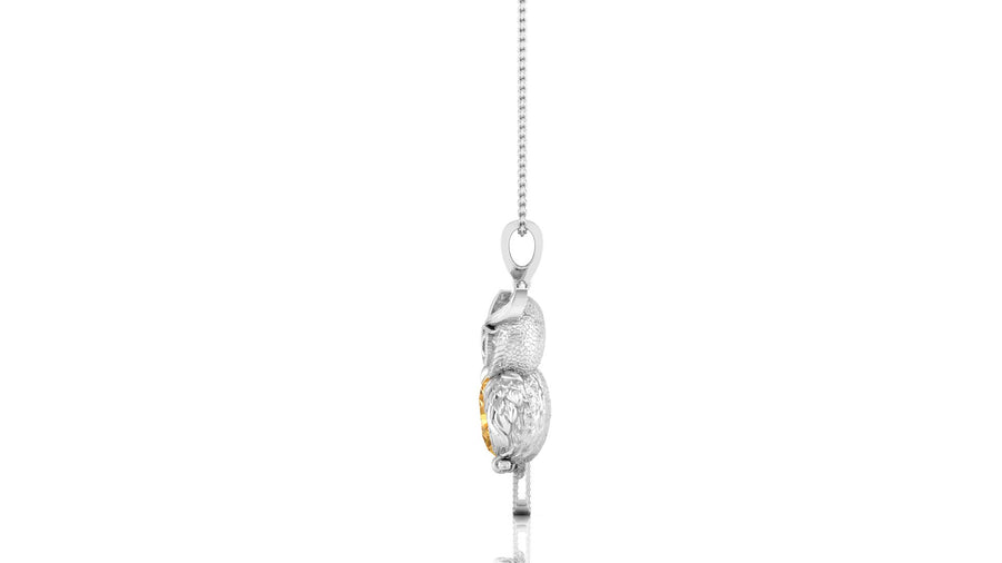 A white gold pendant necklace featuring a detailed owl design with a small gold accent, hanging from a delicate silver chain against a plain white background.