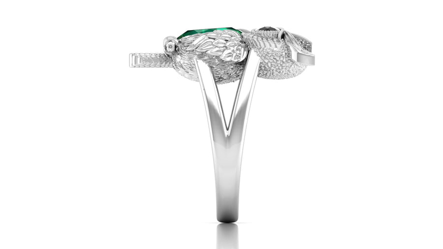 White Gold ring with a green gemstone on a white background