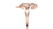 Rose gold ring with a ruby gemstone on a white background