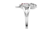 White Gold owl ring with a ruby gemstone on a white background