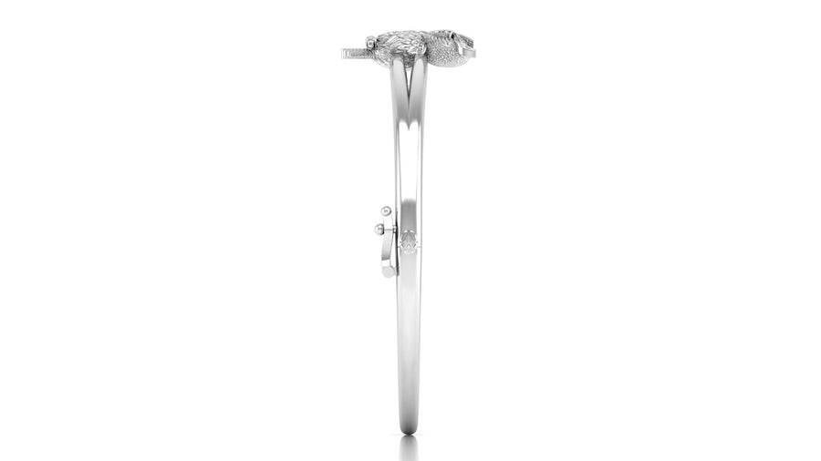 A white gold diamond engagement ring shown in a side profile view against a solid white background.