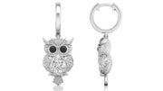 White Gold owl-shaped earrings with diamond gemstones on a white background