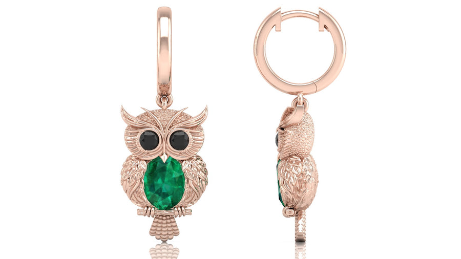 Rose gold owl-shaped earrings with green gemstones on a white background