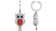 White Gold owl-shaped earrings with red coral gemstones on a white background