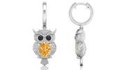 White Gold owl-shaped earrings with yellow sapphire gemstones on a white background