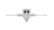 A silver owl pendant bracelet with black eyes and clear gemstone details, displayed on a delicate silver chain against a solid white background.