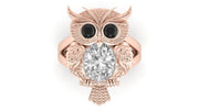 Rose gold owl-shaped brooch with a diamond gemstone on a white background