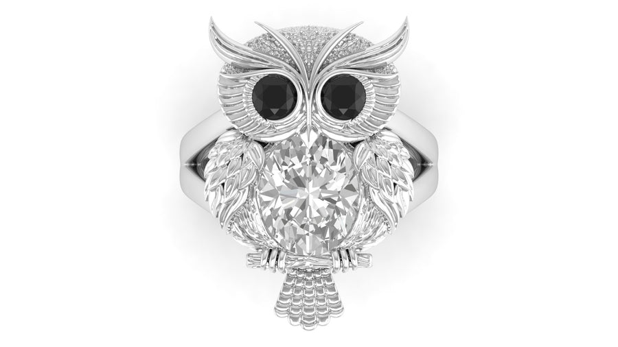White Gold owl ring with a diamond gemstone on a white background