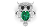 White Gold owl ring with a green gemstone on a white background
