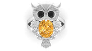 White Gold owl ring with a yellow sapphire gemstone on a white background