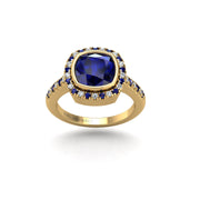 Gold blue sapphire cushion halo ring front view