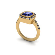 Gold blue sapphire cushion halo ring