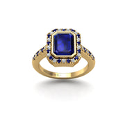 Gold blue sapphire emerald halo ring front view