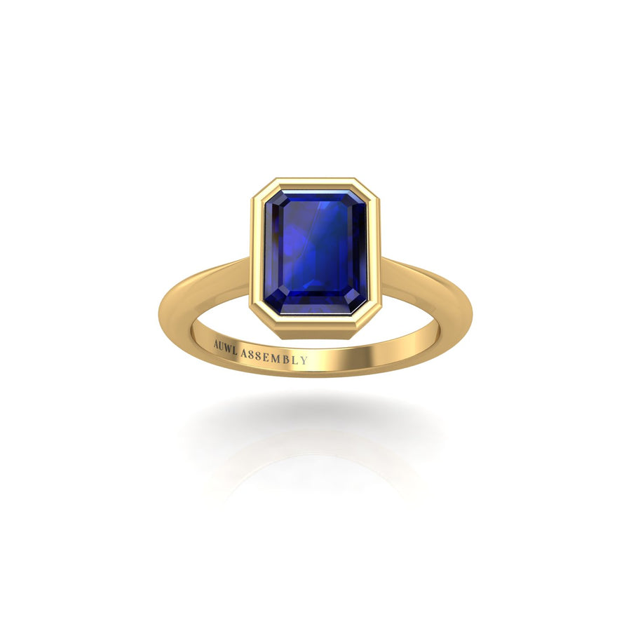 Gold blue sapphire emerald solitaire ring front view