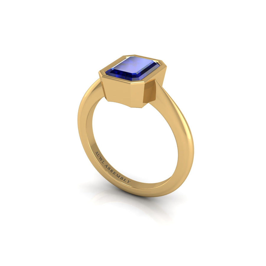 Gold blue sapphire emerald solitaire ring
